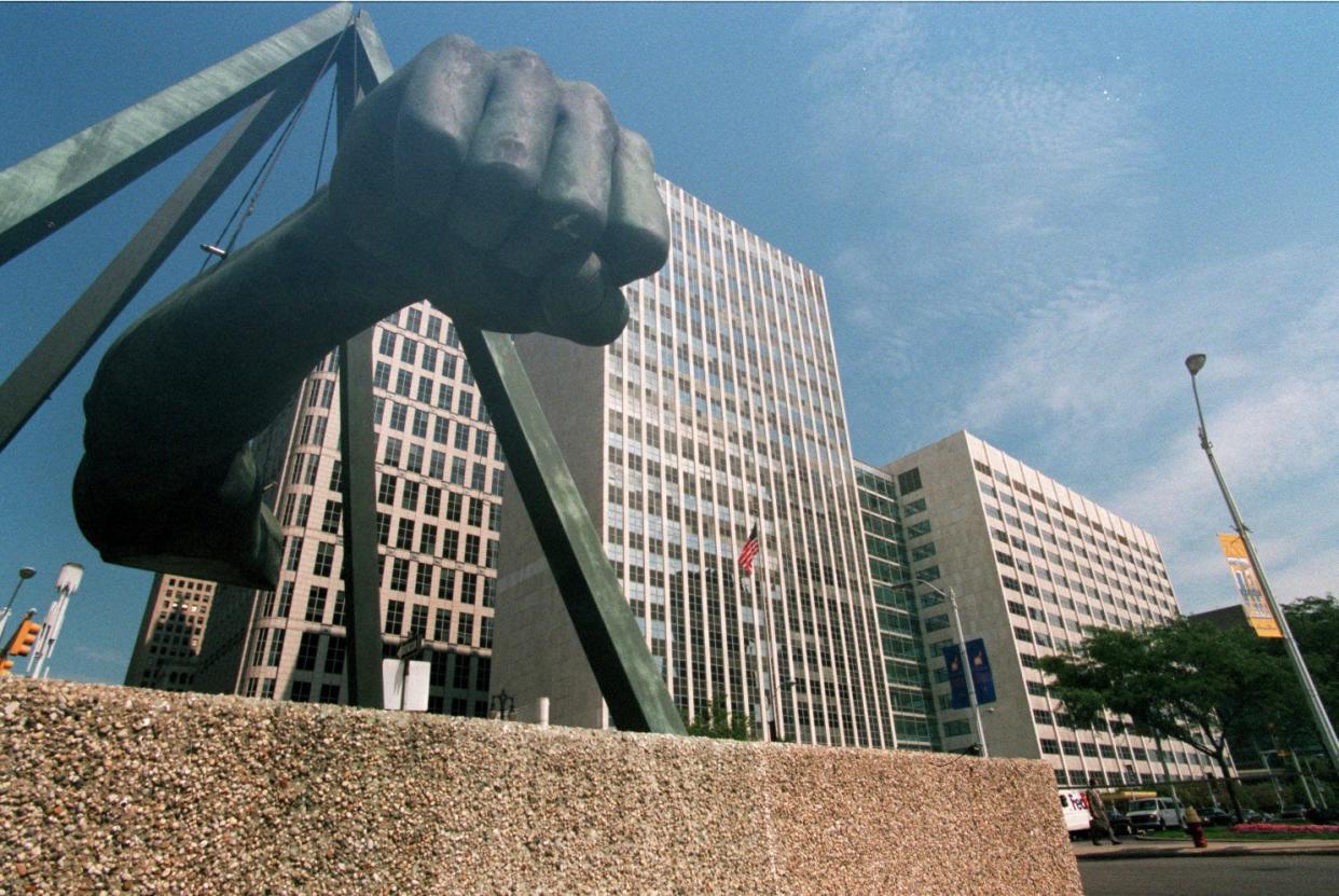 What's commonly known as the Joe Louis Fist, or just the Fist, in the foreground of what's now called the Coleman A. Young Municipal Center. This building was the replacement for Old City Hall.