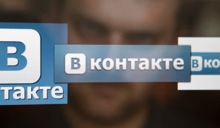 FILE PHOTO: A man looks at a computer screen showing logos of Russian social network VKontakte, in this picture illustration taken May 24, 2013. REUTERS/Sergei Karpukhin/Illustration/File Photo