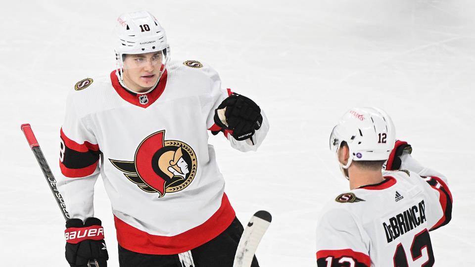 Ottawa Senators' Alex DeBrincat (12) celebrates with teammate Tim Stutzle (18) after scoring against the Montreal Canadiens during second period NHL hockey action in Montreal, Tuesday, January 31, 2023. THE CANADIAN PRESS/Graham Hughes
