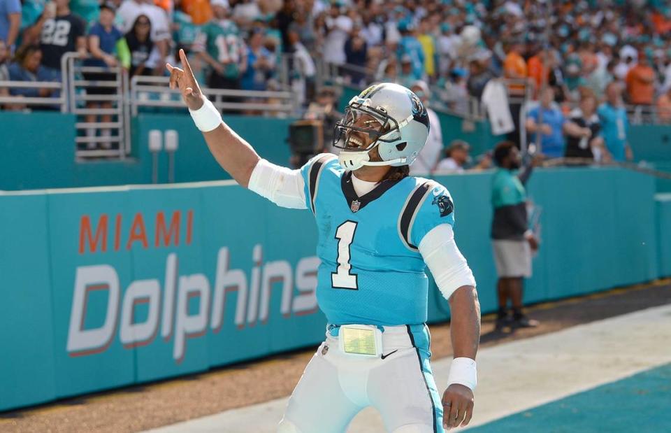 Carolina Panthers quarterback Cam Newton celebrates his rushing touchdown against the Miami Dolphins during first quarter action at Hard Rock Stadium in Miami Gardens, Fla. on Sunday, November 28, 2021.
