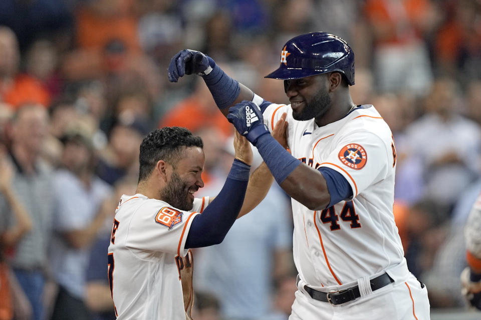 Houston Astros' Yordan Alvarez (44) celebrates with Jose Altuve after hitting a home run against the New York Mets during the third inning of a baseball game Wednesday, June 22, 2022, in Houston. (AP Photo/David J. Phillip)