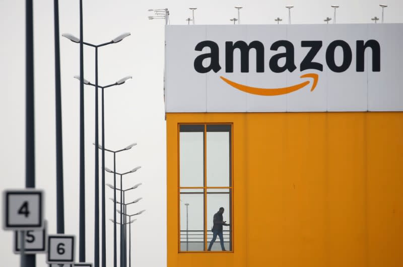 FILE PHOTO: The logo of Amazon is seen at the company logistics center in Lauwin-Planque