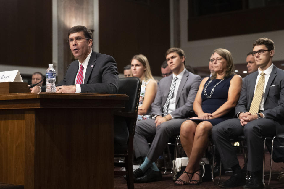 Secretary of the Army and Secretary of Defense nominee Mark Esper accompanied by his family, from back left, daughter Kate Esper, son Luke Esper, his wife Leah Esper and son John Esper, testifies before a Senate Armed Services Committee confirmation hearing on Capitol Hill in Washington, Tuesday, July 16, 2019. (AP Photo/Manuel Balce Ceneta)