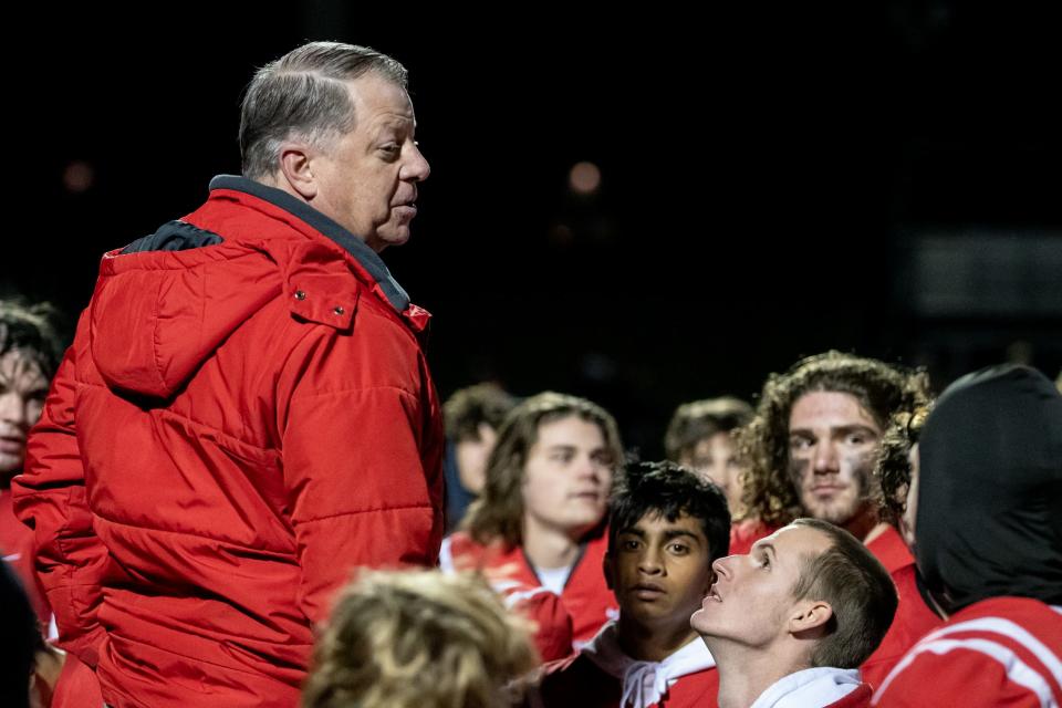 Souderton head coach Ed Gallagher talks to his team after the Big Red's win over Pennsbury in the opening round of the PIAA District One Class 6A playoffs.
