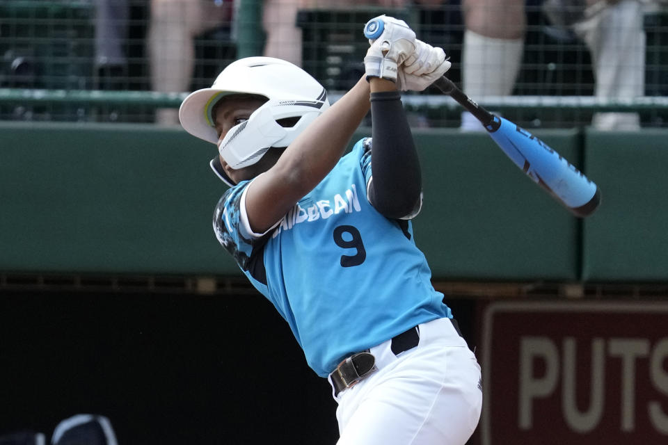 Curacao's Shemar Sophia Jacobus (9) singles off El Segundo, Calif.'s Ollie Parks, driving in a run, in the third inning of the Little League World Series Championship game in South Williamsport, Pa., Sunday, Aug. 27, 2023. (AP Photo/Gene J. Puskar)