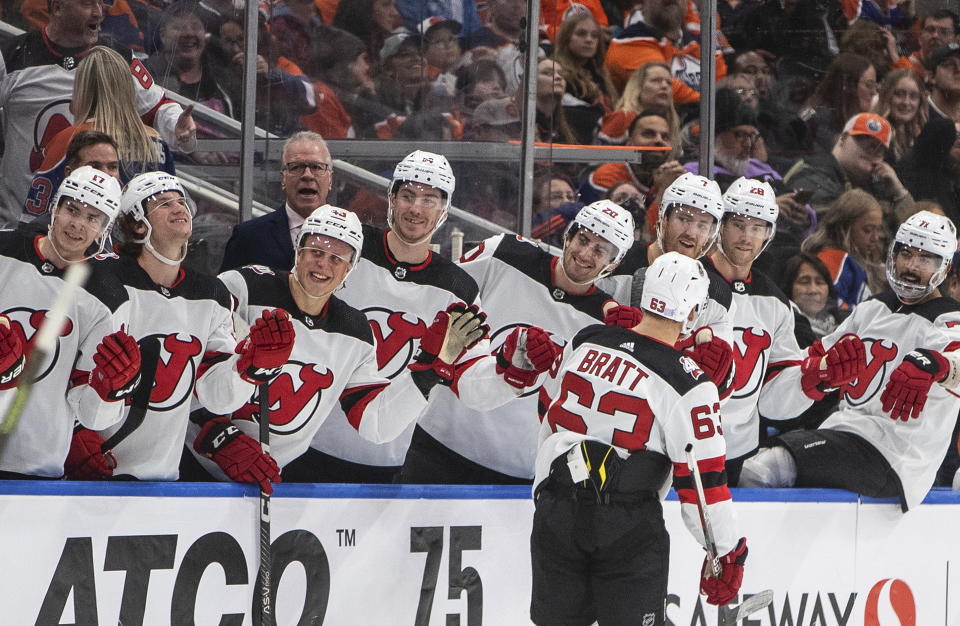 New Jersey Devils' Jesper Bratt (63) is congratulated for a goal against the Edmonton Oilers during the third period of an NHL hockey game Thursday, Nov. 3, 2022, in Edmonton, Alberta. (Jason Franson/The Canadian Press via AP)