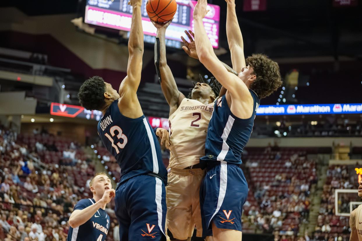 Florida State men's basketball guard Jamir Watkins drives to the hoop against Virginia in an ACC game on Saturday, Feb. 10, 2024.