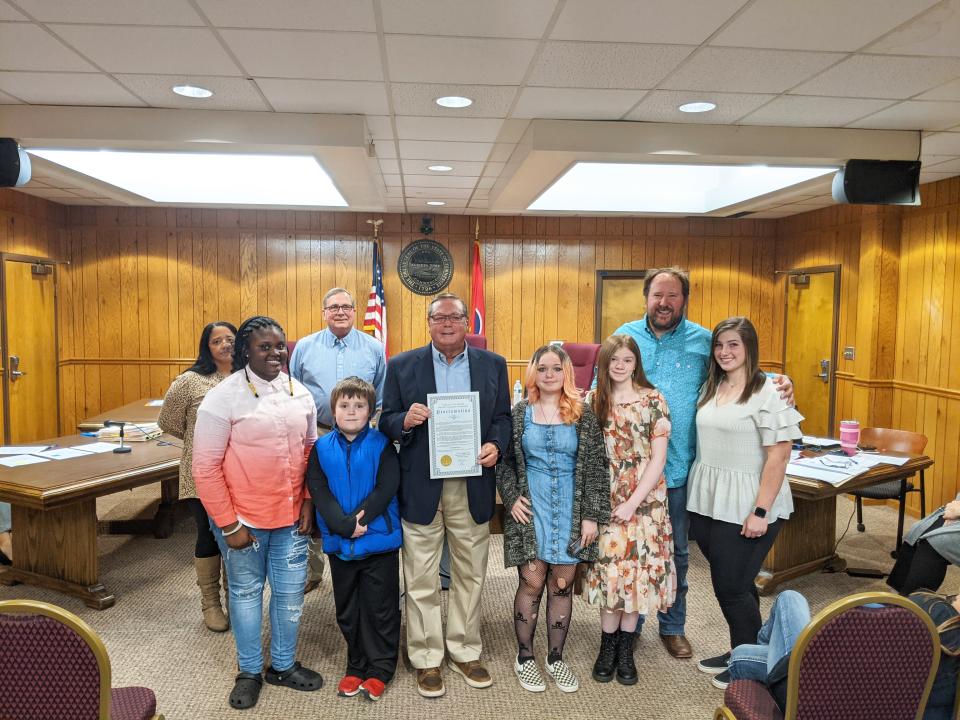 Commissioner Wille Alderson, studnet Emiyah Malone, Commissioner Mike Davis, student Jonah Thomas , Mayor Bill White,  student Mac Wainwright , studnet Allie Sutliffe, Commissioner Eric Harvey and studnet Ann Lee Sandrell pose inside City Hall in Mt. Pleasant Tenn., in November 2021.