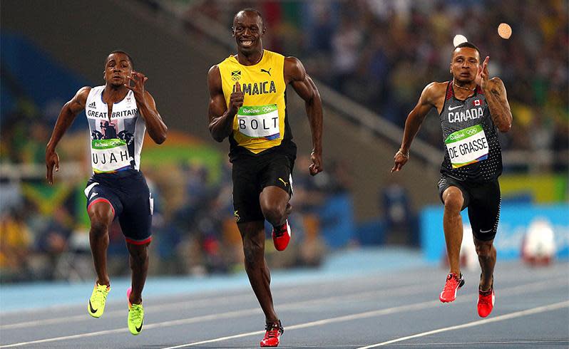 Usain Bolt smiles as he cruises to victory in the second semi-final in Rio, comfortably taking the lead in the men's 100m with a time of 9.86 seconds. Photo: Getty