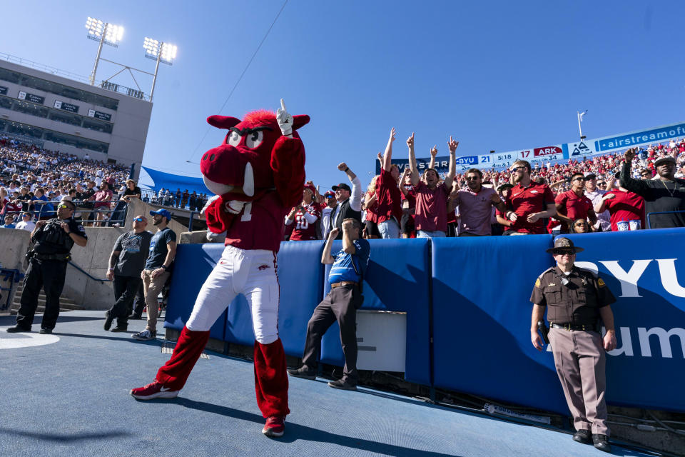 Oct 15, 2022; Provo, Utah, USA; Arkansas Razorbacks fans celebrate after a play in the first half as the Razorbacks face the Brigham Young University Cougars at LaVell Edwards Stadium. Mandatory Credit: Gabriel Mayberry-USA TODAY Sports