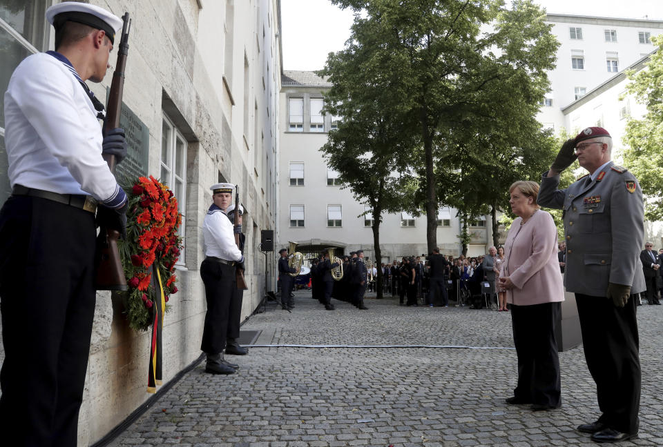 German Chancellor Angela Merkel, second right, attends a memorial event at the Defence Ministry in Berlin, Germany, Saturday, July 20, 2019. On July 20, 2019 Germany marks the 75th anniversary of the failed attempt to kill Hitler in 1944. (AP Photo/Michael Sohn)