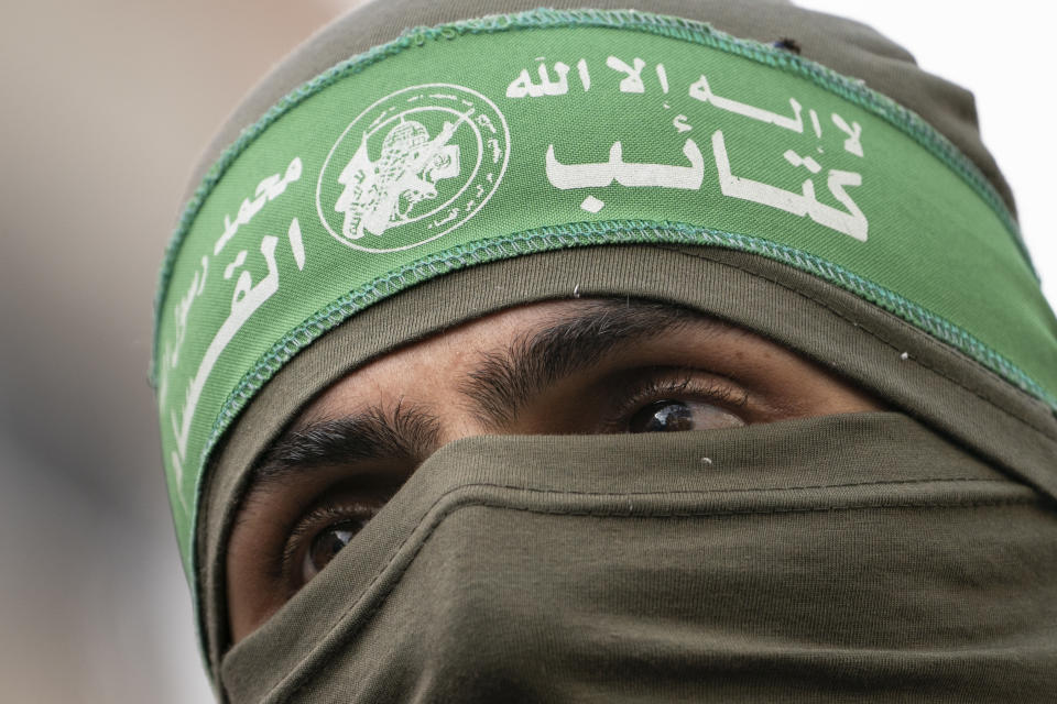 Hamas militants parade through the streets for Bassem Issa, a top Hamas' commander, who was killed by Israeli Defense Force military actions prior to a cease-fire reached after an 11-day war between Gaza's Hamas rulers and Israel, in Gaza City, Saturday, May 22, 2021. (AP Photo/John Minchillo)