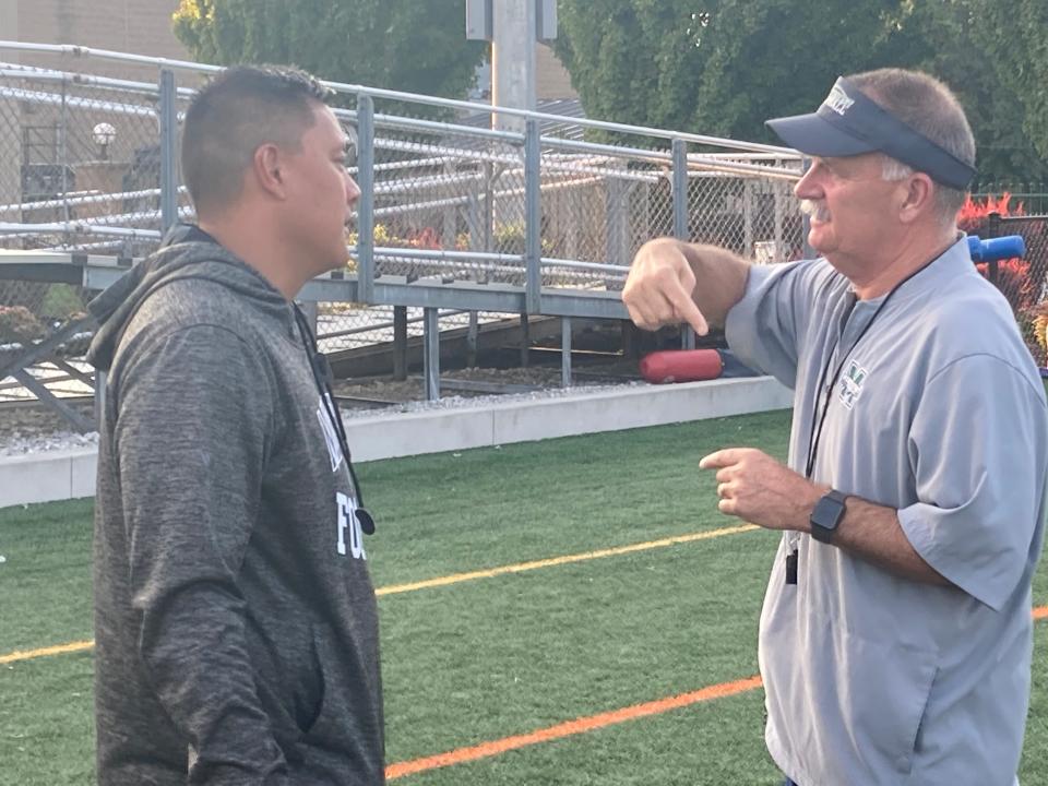 Ryan Riemedio, left, speaks with then-Mercyhurst football coach Marty Schaetzle in 2021 shortly afted Schaetzle announced that Riemedio would succeed him following the 2021 season. “I've watched Ryan grow up, so I know he's ready for this,” Schaetzle said