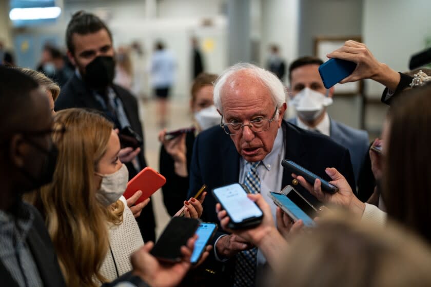 WASHINGTON, DC - SEPTEMBER 30: Sen. Bernie Sanders (I-VT) speaks with reporters in the Senate Subway at the U.S. Capitol on Thursday, Sept. 30, 2021 in Washington, DC. The Senate passed a short term spending bill to avoid a government shutdown. (Kent Nishimura / Los Angeles Times)