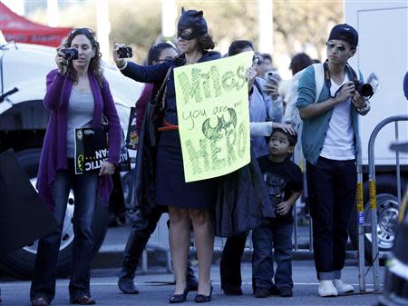 Fans of five-year-old leukemia survivor Miles Scott, aka "Batkid" take pictures at San Francisco City Hall during a ceremony arranged by the Make- A - Wish Foundation in San Francisco, California November 15, 2013. REUTERS/Stephen Lam