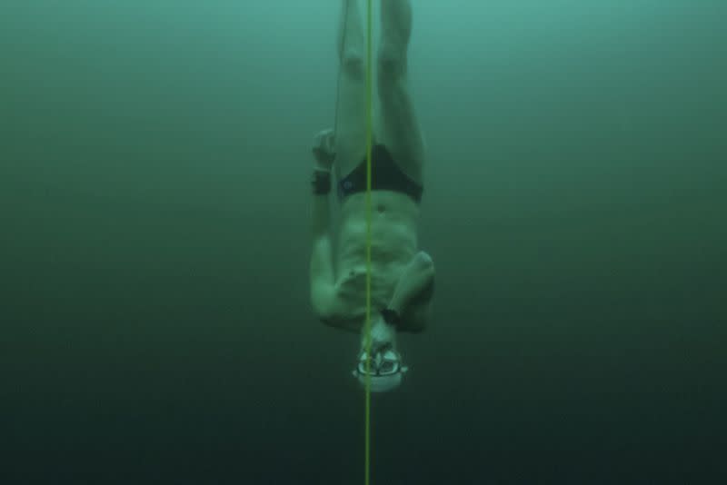 Czech freediver Vencl dives to 52 metres under the ice in Sils