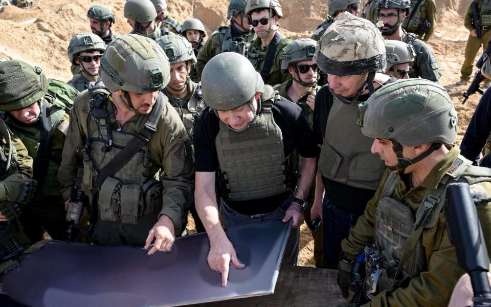 Benjamin Netanyahu, himself a former soldier, talks tactics with troops inside the Gaza Strip