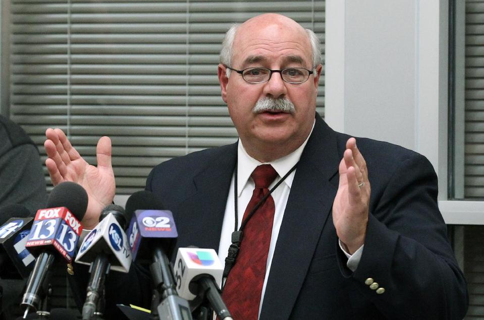 Utah County Sheriff Jim Tracy speaks during a news conference Friday, Jan. 31, 2014, in Spanish Fork, Utah. Authorities say the man accused of killing Utah County Sheriff's Sgt. Cory Wride and wounding another deputy was a fugitive who previously served prison time for attempted homicide. Tracy says the suspect clashed with officers and shot another deputy in the head during a 50-mile chase. That deputy is in critical condition. (AP Photo/Rick Bowmer)