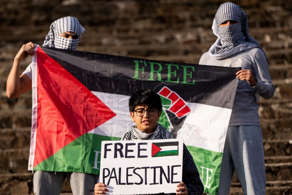 Mar 8, 2024; Montclair, NJ, United States; Dylan Torre (center) holds as sign as New Jersey Students for Justice in Palestine hold a protest at Montclair State University after administrators withdrew approval for a fundraiser called "Palestine Lives." The fundraiser for humanitarian relief in Gaza was canceled the day before the event amid heightened scrutiny of pro-Palestinian activism on campus.