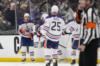 Edmonton Oilers left wing Zach Hyman (18) celebrates with teammates after scoring during overtime of Game 4 of an NHL hockey Stanley Cup first-round playoff series hockey game against the Los Angeles Kings Sunday, April 23, 2023, in Los Angeles. The Oilers won 5-4. (AP Photo/Ashley Landis)