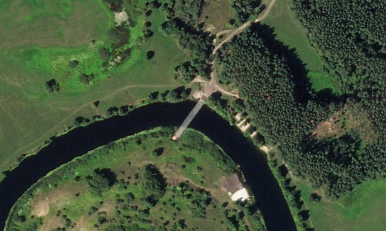 <span>Satellite photo shows a pontoon bridge across the Seym River east of the town of Glushkovo in Russia's Kursk region.</span><span>Photograph: Planet Labs PBC/AP</span>