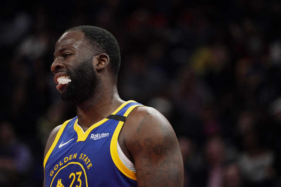 Draymond Green #23 of the Golden State Warriors looks on against the Washington Wizards in the second half at Capital One Arena.