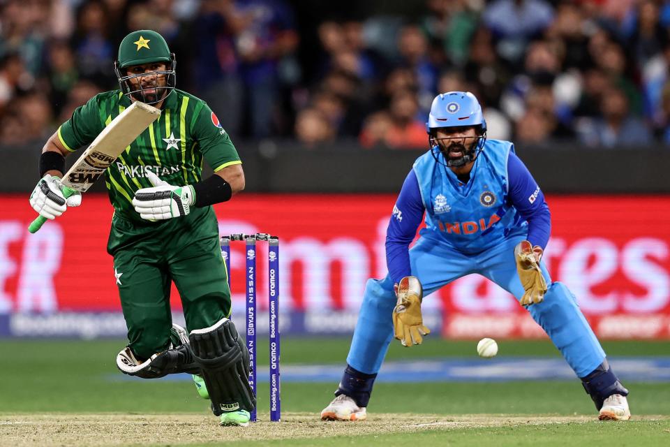 Pakistan's Iftikhar Ahmed (L) plays a shot during the ICC men's Twenty20 World Cup 2022 cricket match between India and Pakistan at Melbourne Cricket Ground (MCG) in Melbourne on October 23, 2022.