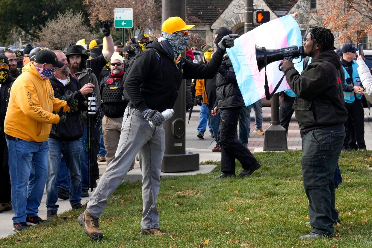 A Proud Boy approaches at counter-protester using a megaphone outside of Our Lady of Peace Catholic Church on Dec. 3, 2022,ing after a protest against Holi-drag, an event at the Red Oak Community School, where local drag queens read story books. The event was canceled due to a safety concerns, the school said on social media.