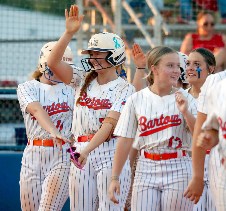 Bartow pitcher Red Oxley does the Gator Chomp after hitting her first home run against East River on Thursday night in the Class 6A, Region 3 quarterfinals.