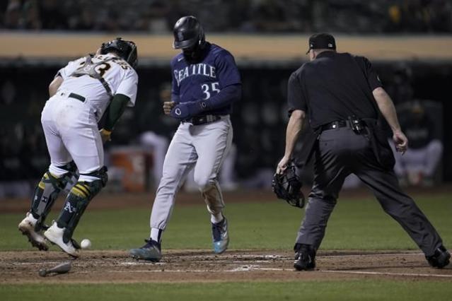 Crawford homers, Kelenic drives in two to back Castillo's win as Mariners  beat A's 7-2