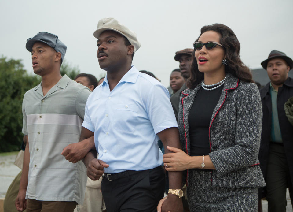 Coretta marches with her husband in a vintage suit