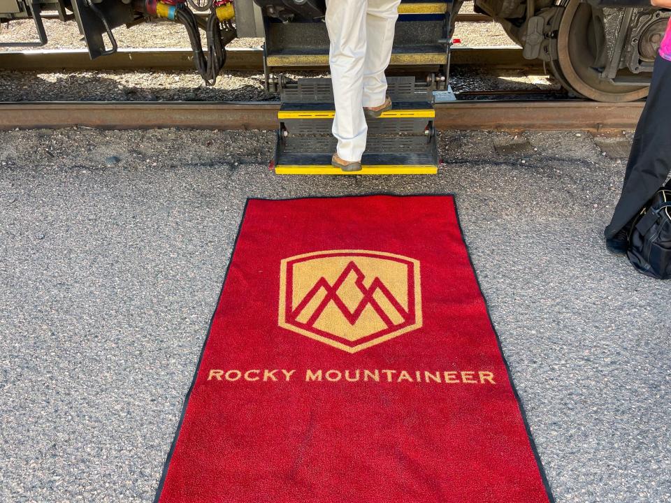 A passenger steps onboard the Rocky Mountaineer train in Denver, Colorado.