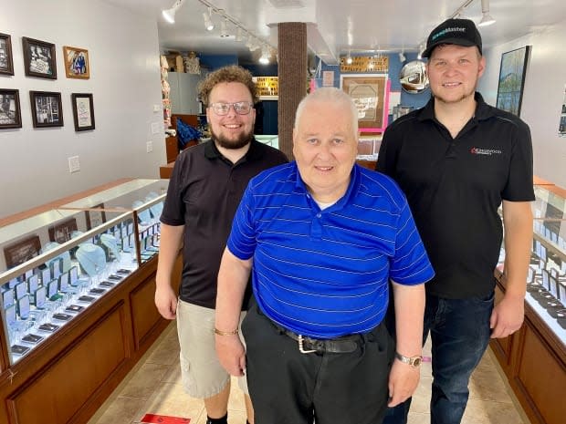 Grant Moase, centre, is closing down the family run Moase Quality Jewellers after 80 years. His two sons Gregory, left, and Matthew have worked at the store for years. (Jane Robertson/CBC - image credit)