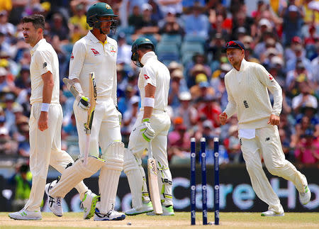 Cricket - Ashes test match - Australia v England - WACA Ground, Perth, Australia, December 17, 2017. England's captain Joe Root and team mate James Anderson celebrate after Australia's Mitchell Starc was run out during the fourth day of the third Ashes cricket test match. REUTERS/David Gray