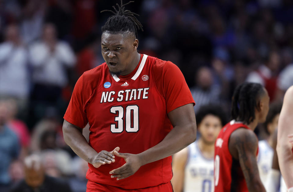 DALLAS, TEXAS - MARCH 31: DJ Burns Jr. #30 of the North Carolina State Wolfpack reacts after drawing a foul in the Elite 8 round of the NCAA Men's Basketball Tournament against the Duke Blue Devils at American Airlines Center on March 31, 2024 in Dallas, Texas. (Photo by Carmen Mandato/Getty Images)