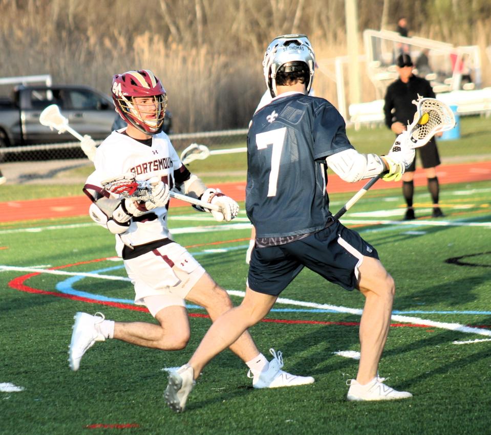 STA's Trent Salyards, right, looks to put a move on Portsmouth's Zac Amend during Division II action Monday night in Portsmouth.