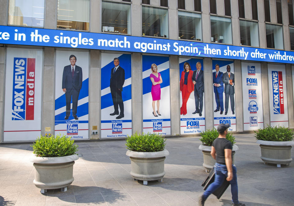 Pictured in promotional posters outside Fox News studios at News Corporation headquarters in New York on Saturday, July 31, 2021, are hosts Tucker Carlson, Sean Hannity, Laura Ingraham, Maria Bartiromo, Stuart Varney, Neil Cavuto and Charles Payne. (AP Photo/Ted Shaffrey)