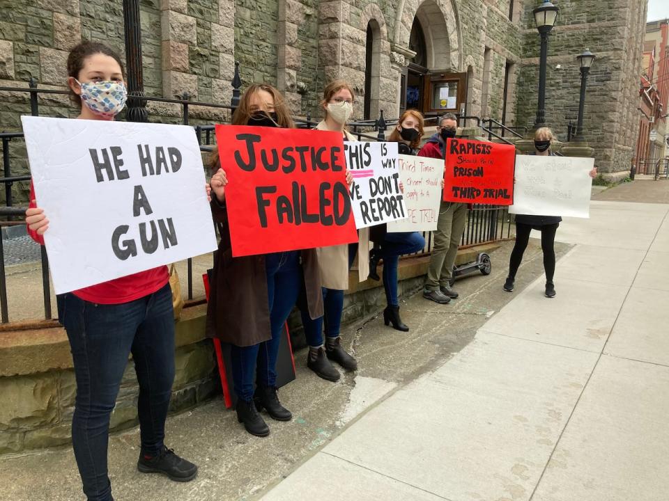 A handful of protesters showed up at Supreme Court Monday to voice their displeasure over the result of Doug Snelgrove's second sexual assault trial.