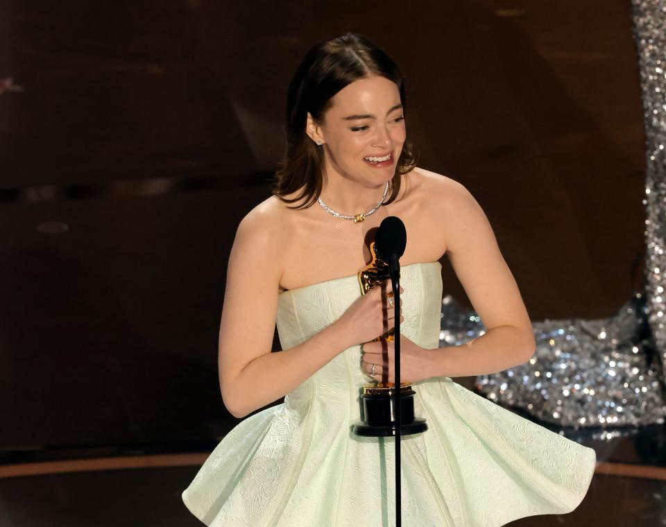 Emma Stone accepts the Best Actress in a Leading Role award for "Poor Things" onstage during the 96th Annual Academy Awards.