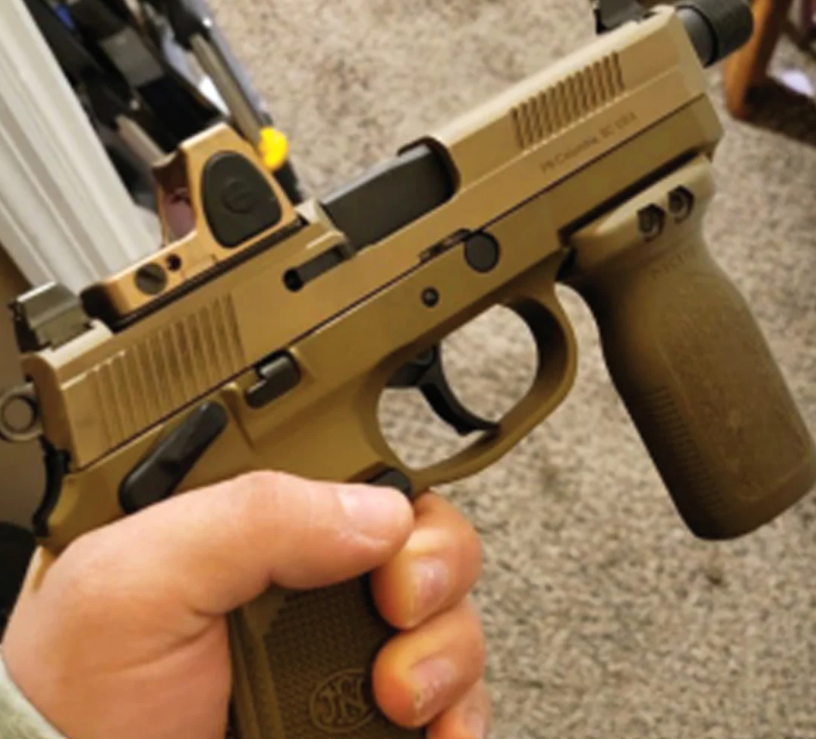 A handgun alleged to have been modified by Thomas Develin, which would be subject to additional federal rules, in a photo included in a criminal complaint.