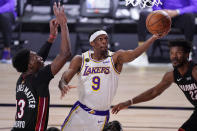 Los Angeles Lakers' Rajon Rondo (9) goes up for a shot against Miami Heat's Bam Adebayo (13) during the first half in Game 6 of basketball's NBA Finals Sunday, Oct. 11, 2020, in Lake Buena Vista, Fla. (AP Photo/Mark J. Terrill)