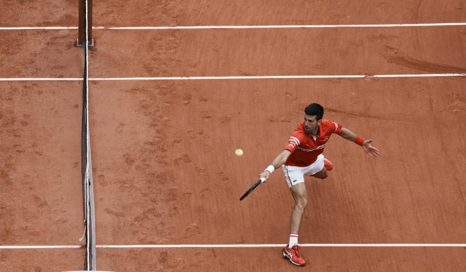 Serbia's Novak Djokovic plays a return to Lithuania's Ricardas Berankis during their third round match on day 7, of the French Open tennis tournament at Roland Garros in Paris, France, Saturday, June 5, 2021. (AP Photo/Thibault Camus)