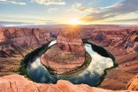 <p><a href="https://horseshoebend.com/" rel="nofollow noopener" target="_blank" data-ylk="slk:Horseshoe Bend;elm:context_link;itc:0;sec:content-canvas" class="link ">Horseshoe Bend</a> is located about a 20-minute drive from Antelope Canyon. Once you park, it’s a nice, low intensity walk down to the iconic view. This site defines surreal, but don’t let it fool you and stay away from the edge. </p><p>There aren’t any rails or anything, and tourists will dangle their feet over the edge to get that perfect shot. </p>