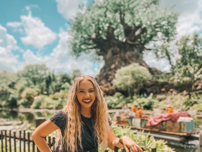 kayleigh price in front of the tree of life at animal kingdom in disney world