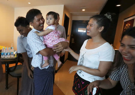 Reuters reporters Wa Lone and Kyaw Soe Oo celebrate with family members after being freed from prison, after receiving a presidential pardon in Yangon, Myanmar, May 7, 2019. REUTERS/Ann Wang/Pool