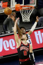 Minnesota Timberwolves forward Jaden McDaniels (3) blocks a shot by Chicago Bulls guard Zach LaVine (8) in the first quarter of an NBA basketball game, Sunday, April 11, 2021, in Minneapolis. (AP Photo/Andy Clayton-King)