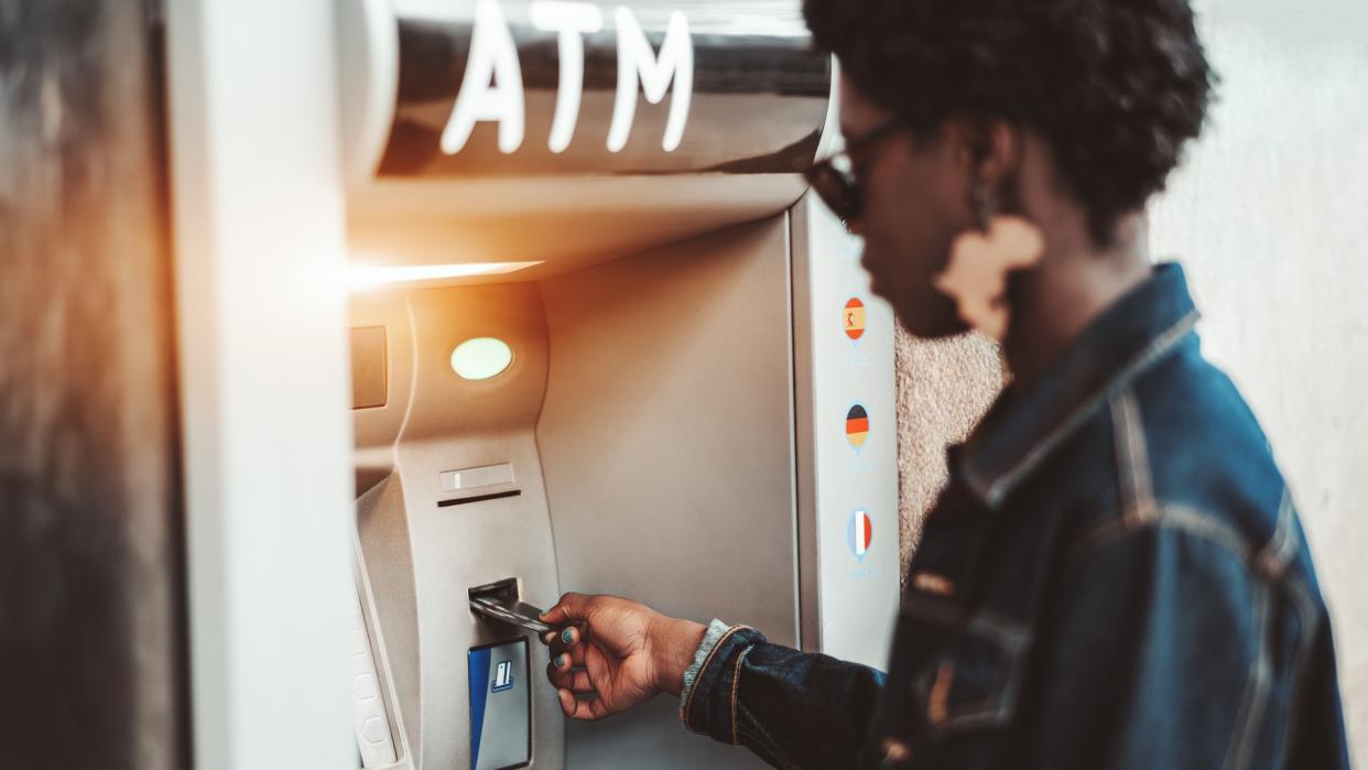 woman using atm machine