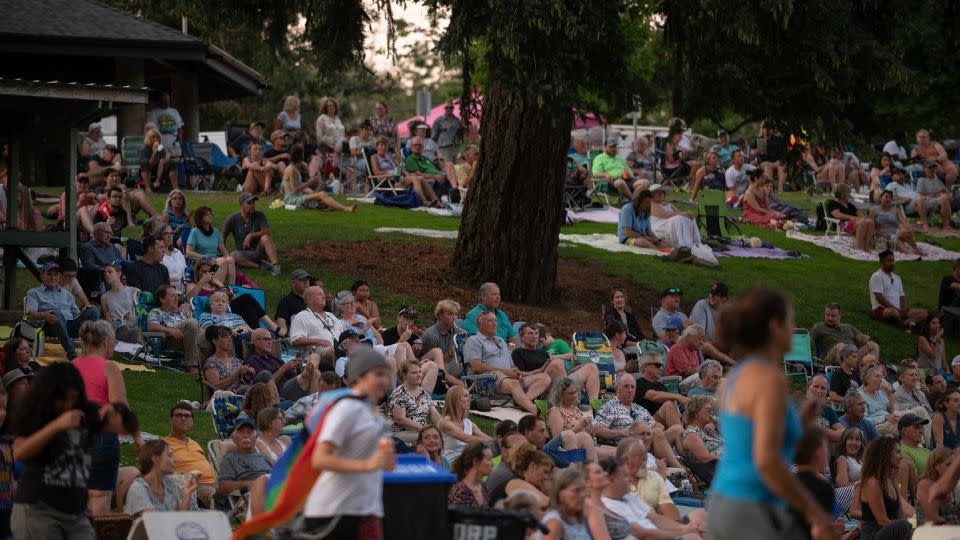 People watch an outdoor concert at Stewart Park in Roseburg. - Will Lanzoni/CNN
