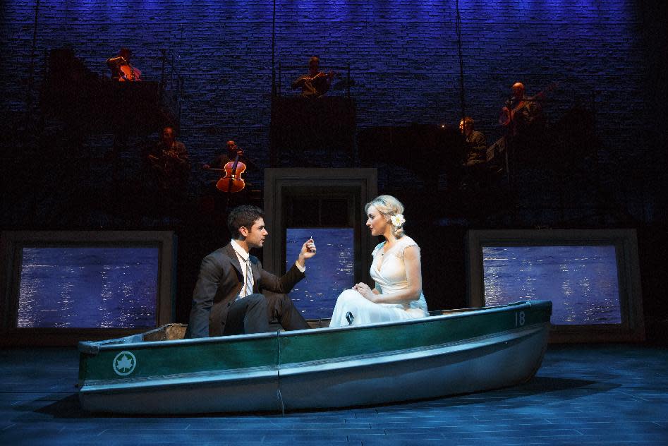 This theater image released by The Hartman group shows Adam Kantor, left, and Betsy Wolfe during a performance of "The Last Five Years," in New York. A revival of Jason Robert Brown's song cycle about a troubled marriage was a highlight of Second Stage Theatre's last season. (AP Photo/The Hartman Group, Joan Marcus)