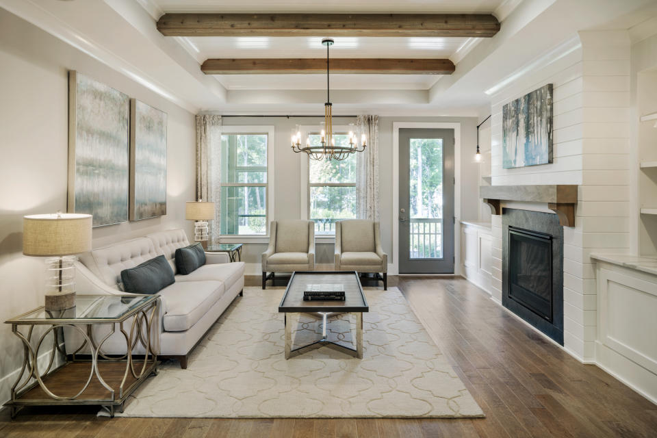 This photo provided by Ashton Woods shows a residential family room with natural wood beams as part of the ceiling in the Ashton Woods GlenPark community in Raleigh, N.C. (William Taylor/Taylorphoto/Ashton Woods via AP)